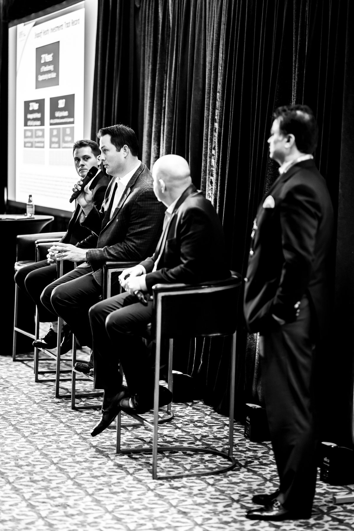 Ryan Smith speaking on a panel at a prior advisor conference