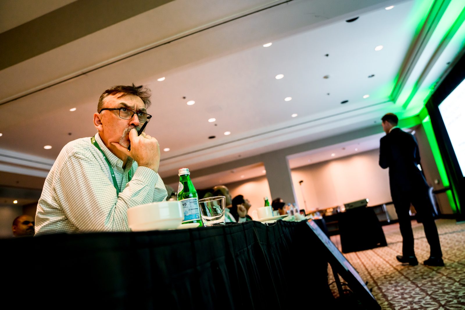 An attendee listening during a session at a prior advisor conference
