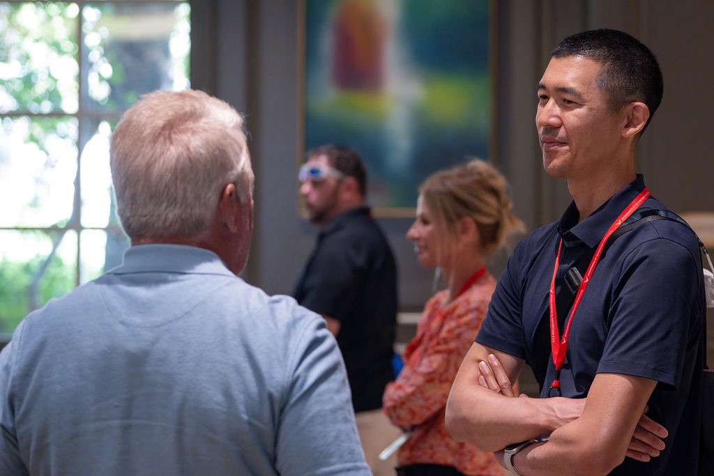 An investor and a team member talking one-on-one at an event